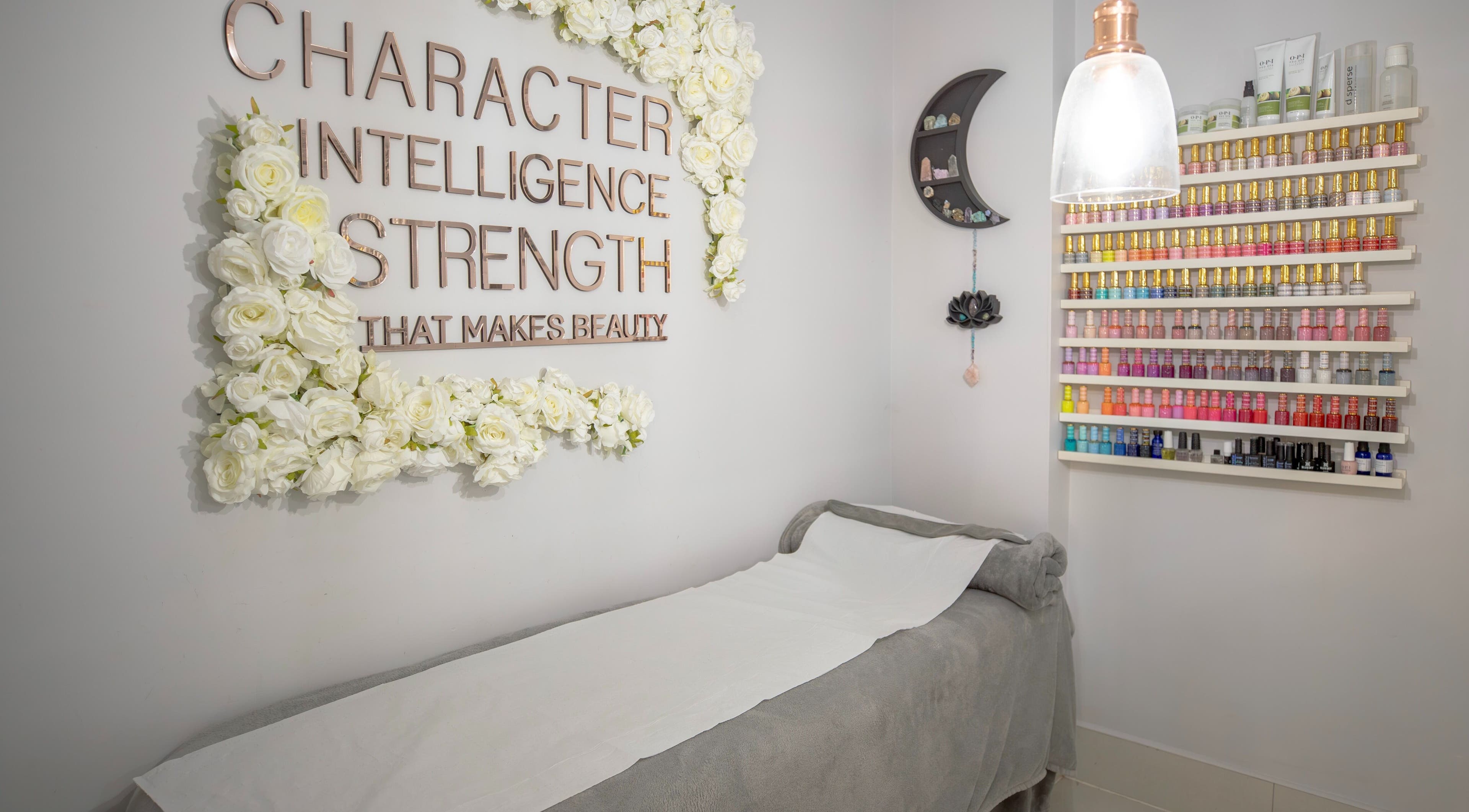 Kaimia in Hayes, England, GB offers a serene treatment room with a floral theme and colorful nail polish display.