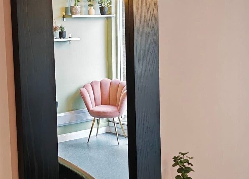Stylish pink chair at Eden Hair Studio, Port Seton, Scotland, GB, offering a chic atmosphere for clients.