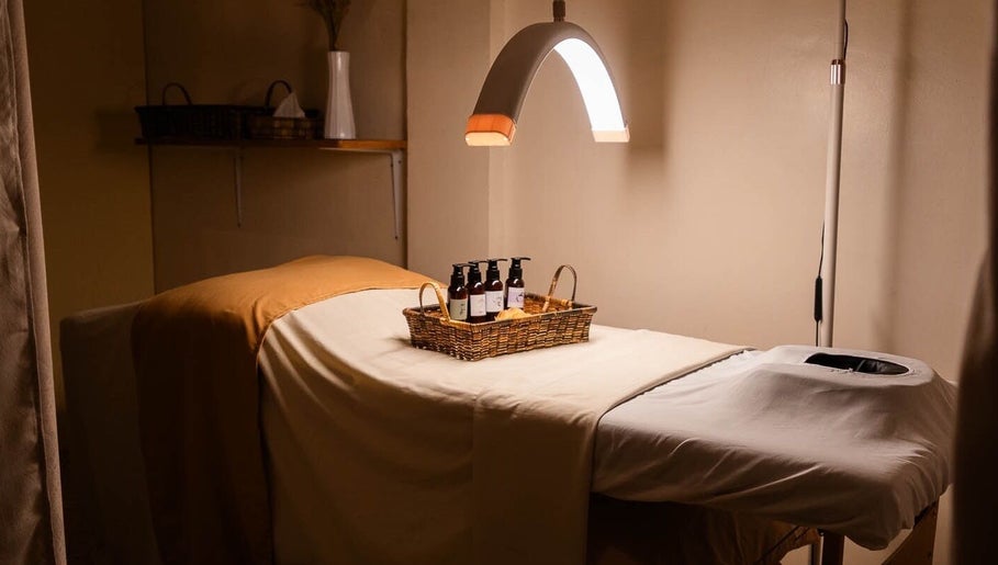 Tranquil massage room at Elle. Massage Therapy & Wellness Iloilo, Iloilo City, PH, with oils on table.