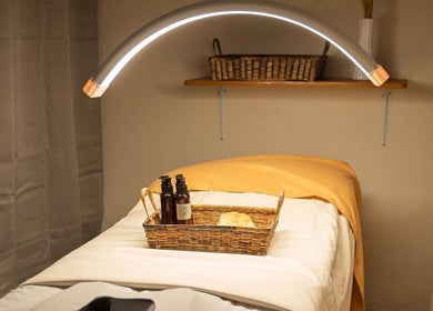 Relaxing massage table at Elle. Massage Therapy & Wellness Iloilo, Iloilo City, PH with calming lighting and towels.