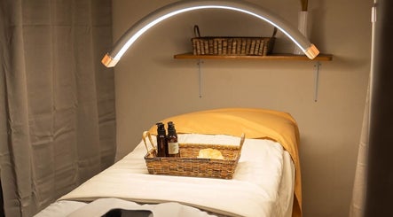 Relaxing massage table at Elle. Massage Therapy & Wellness Iloilo, Iloilo City, PH with calming lighting and towels.