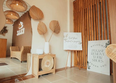 Calm entryway at Elle. Massage Therapy & Wellness Iloilo, Iloilo City, PH with rattan furniture and decor.
