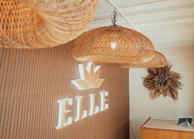 Rustic interior of Elle. Massage Therapy & Wellness Iloilo, Iloilo City, PH with woven lights and elegant decor.