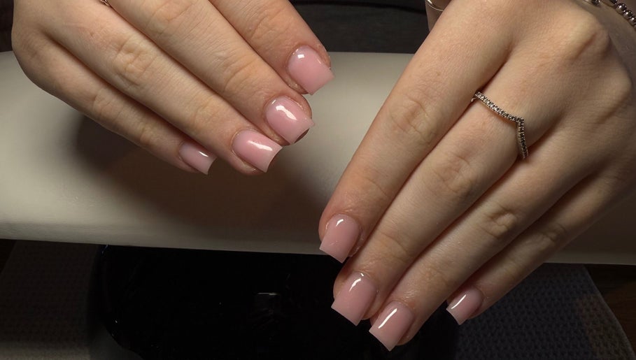 Elegant pink manicured nails at The Beauty Lounge, Swindon, England, GB, showcasing professional nail artistry.