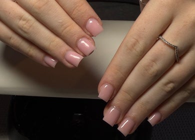 Elegant pink manicured nails at The Beauty Lounge, Swindon, England, GB, showcasing professional nail artistry.