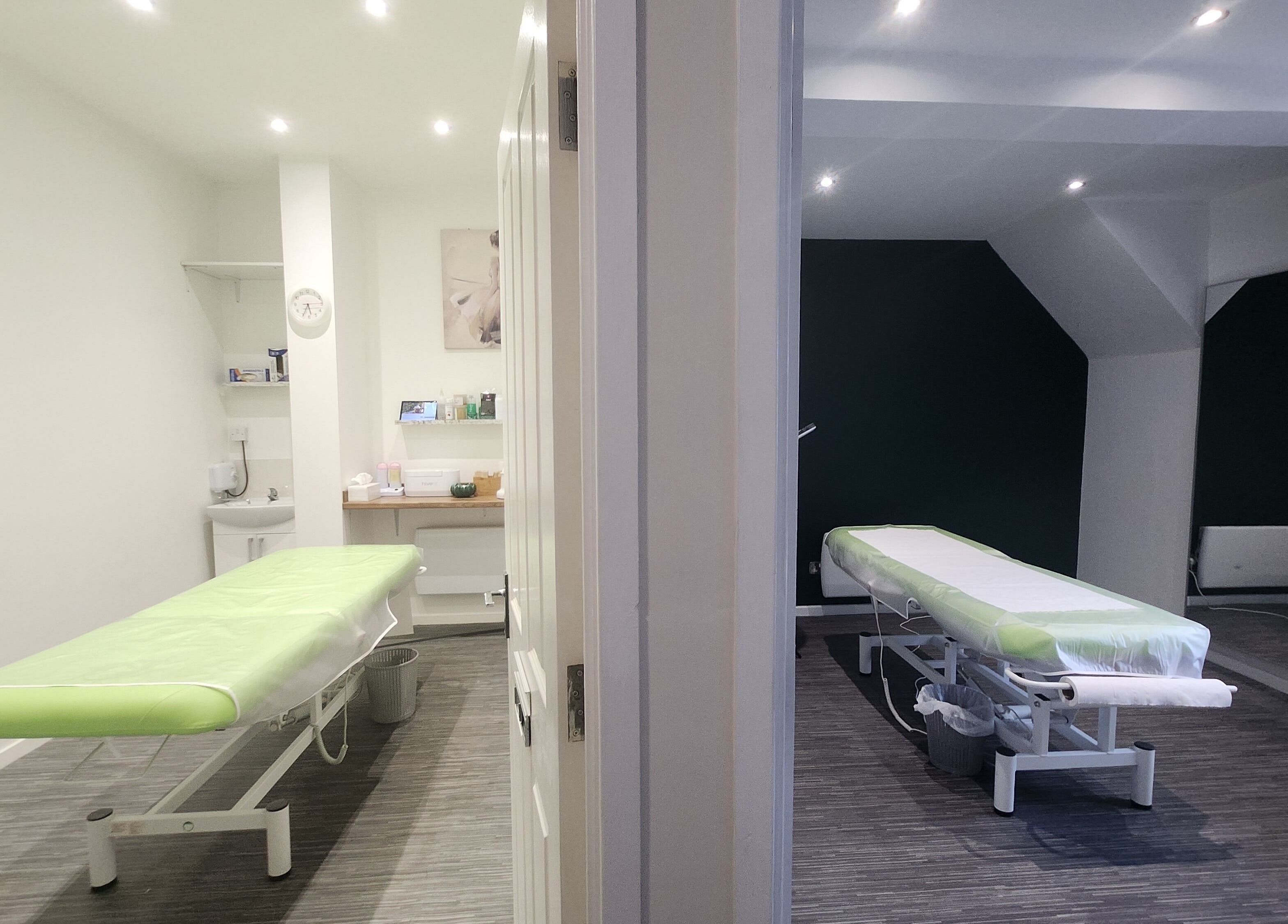 Tranquil treatment rooms at Next Level Spa & Beauty in Wallsend, England, GB, featuring massage beds.