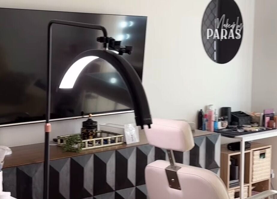 Beauty setup at By Paras, Carindale, Queensland, AU. Modern chair, products, and signature decor visible.