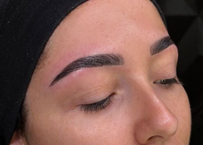 Close-up of expertly shaped eyebrows at By Paras, Carindale, Queensland, AU.