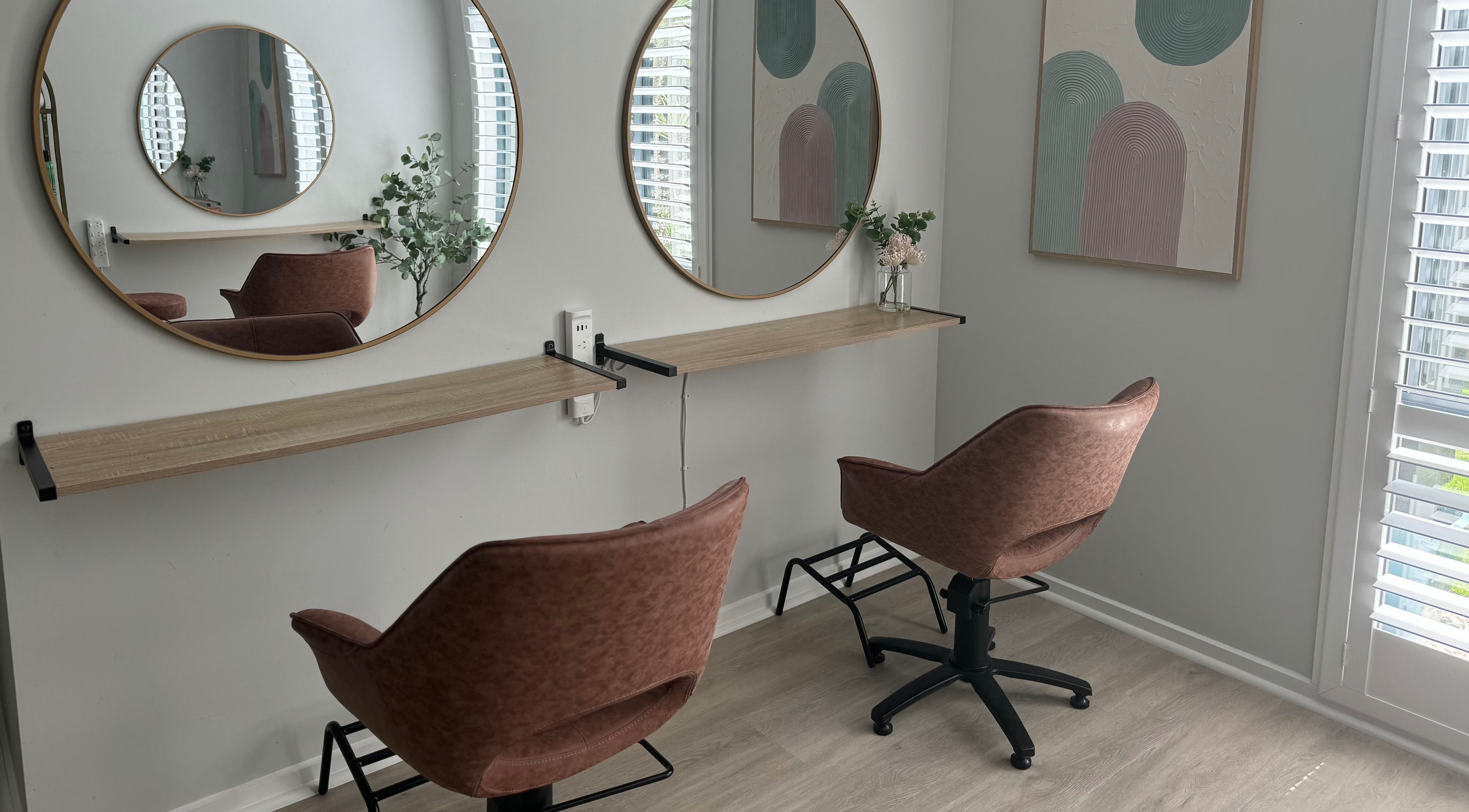 Chic salon setup at Studio 12 - Hair By Fiona, Thornlands, Queensland, AU with stylish chairs and mirrors.