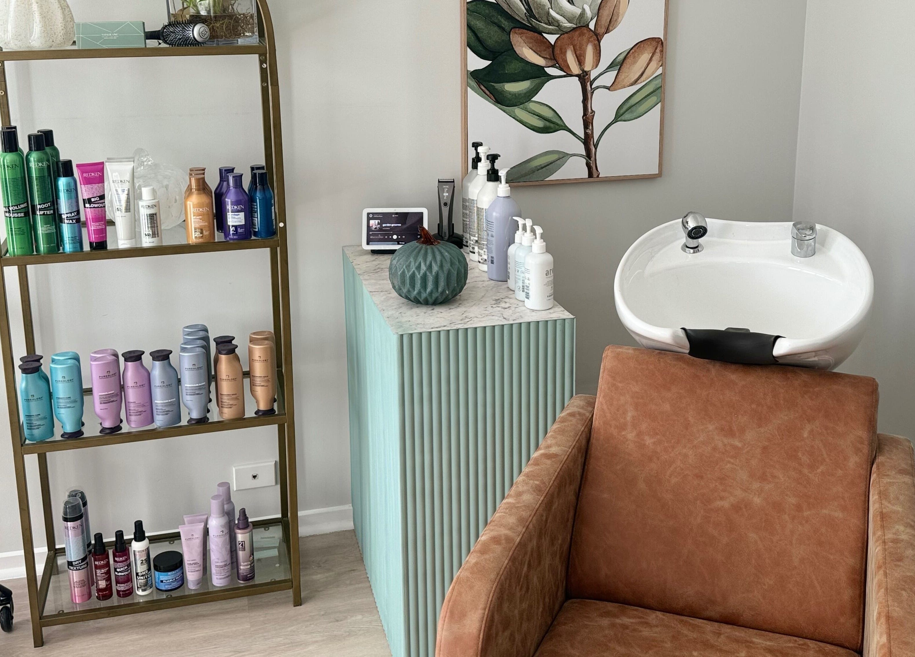 Chic salon setup at Studio 12 - Hair By Fiona, Thornlands, Queensland, AU with products and a stylish wash basin.