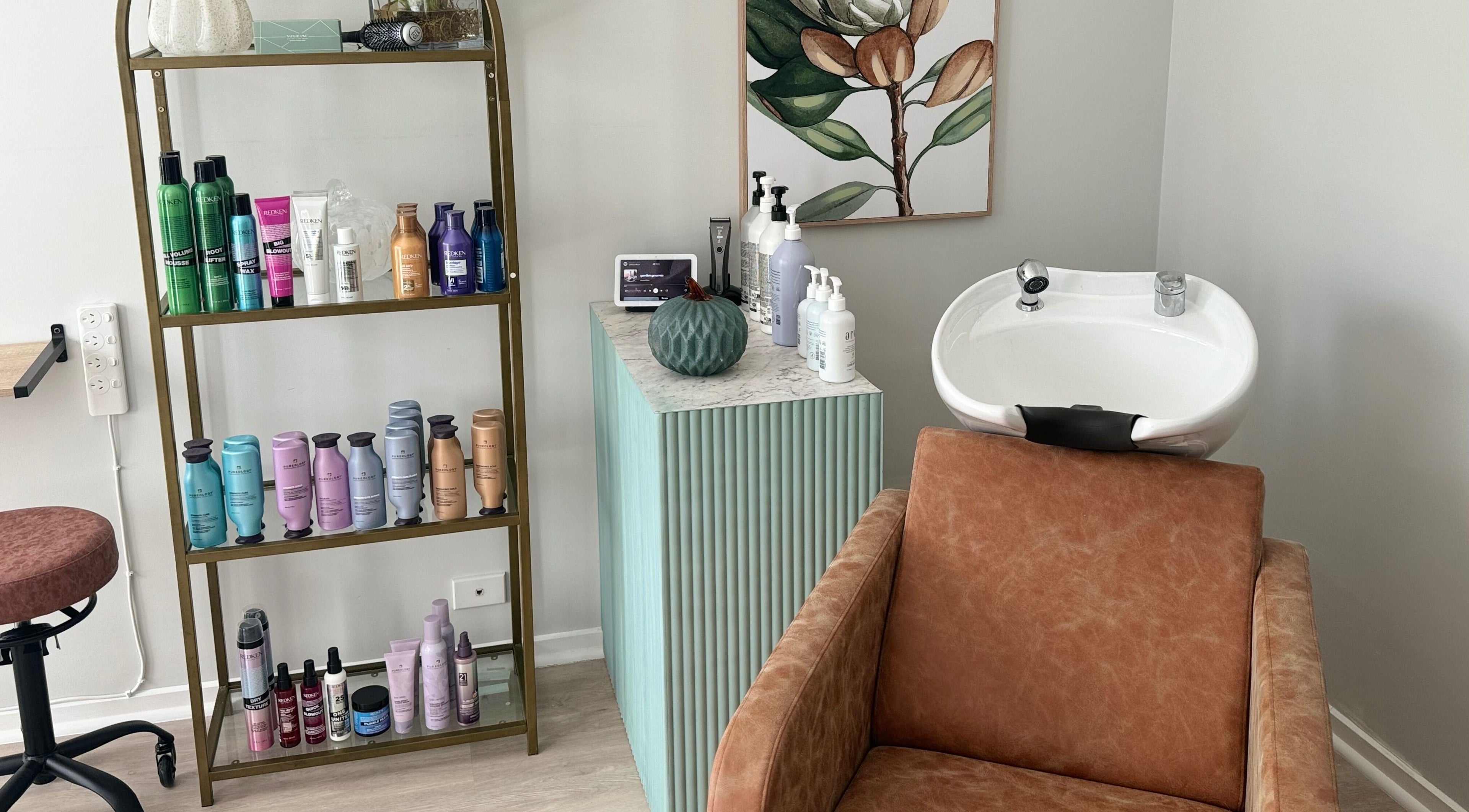 Chic salon setup at Studio 12 - Hair By Fiona, Thornlands, Queensland, AU with products and a stylish wash basin.