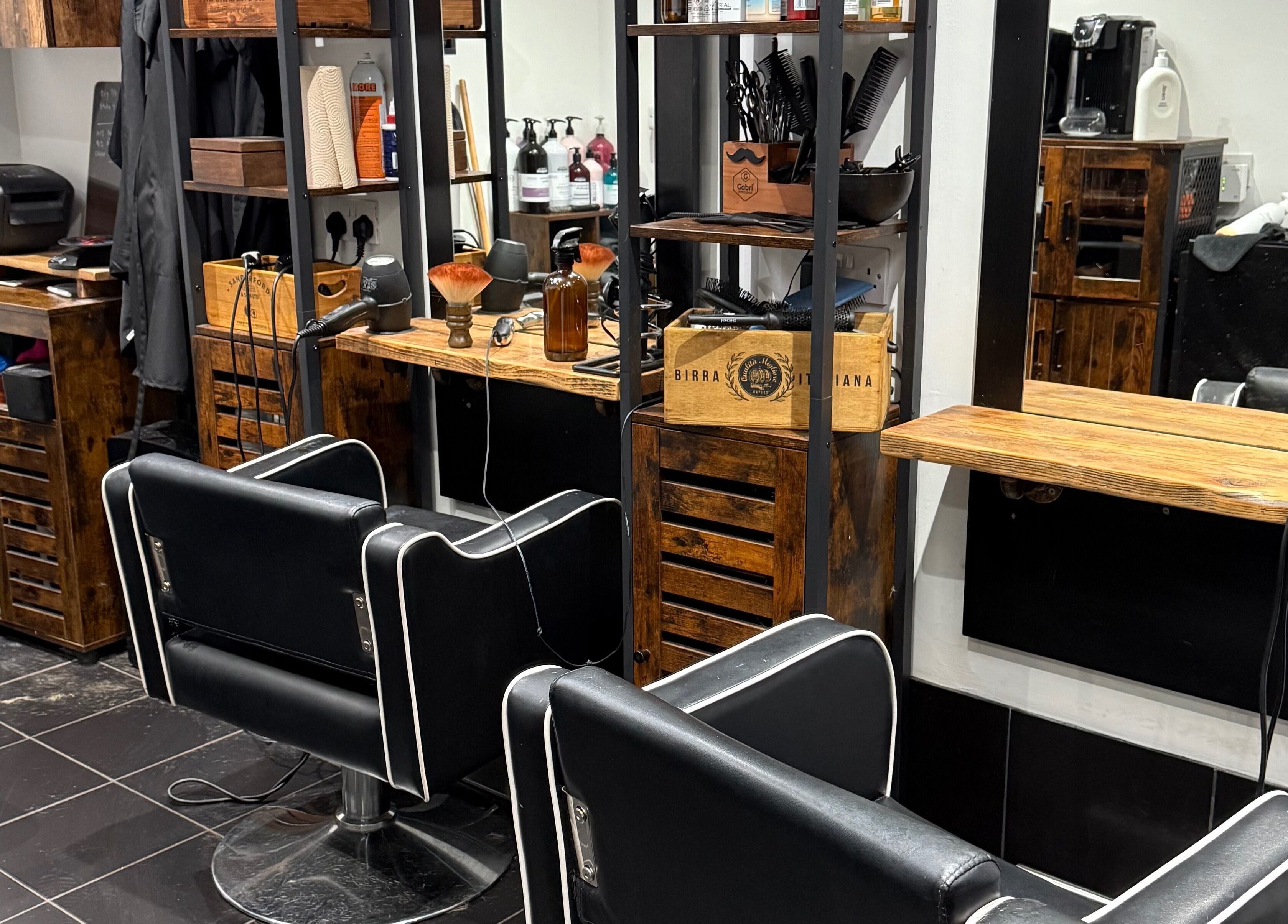 Luxury salon chairs at The Mane Room, Cookham, England, GB. Modern styling setup for a premium grooming experience.