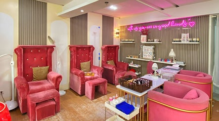 Luxurious red velvet chairs at Daily Lounge Salon, Makati, Metro Manila, PH, offering a relaxing ambiance.