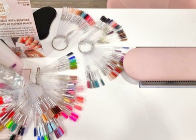 Colorful nail polish samples at Naiyah Nails, London, England, GB showcasing manicure options.