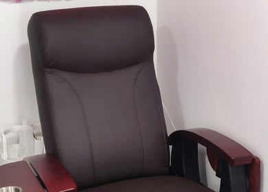Comfortable salon chair at Naiyah Nails, London, England, GB, perfect for relaxing manicure sessions.