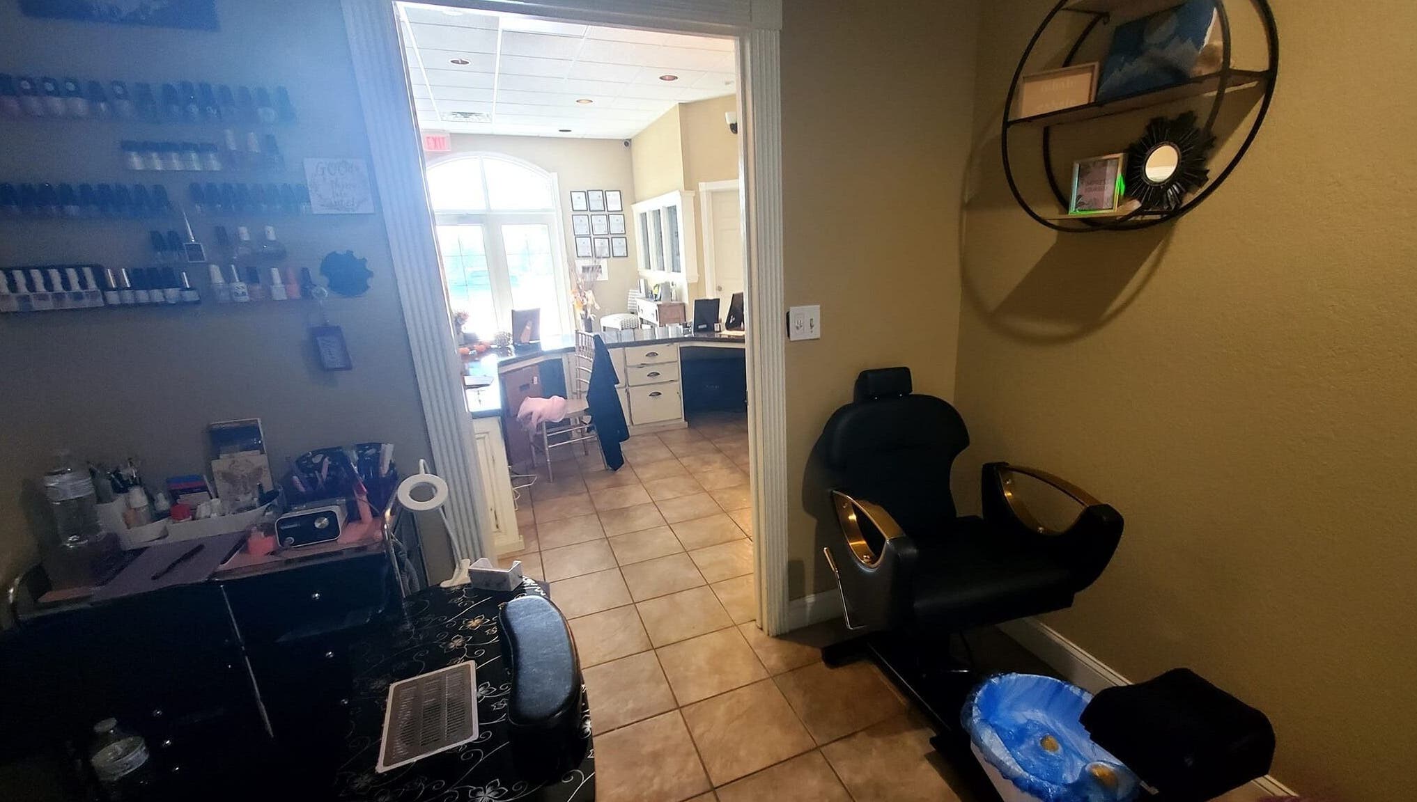 Inviting nail station at Nails by Coco LLC in Van Buren, Arkansas, US, showcasing warm decor and manicure setups.