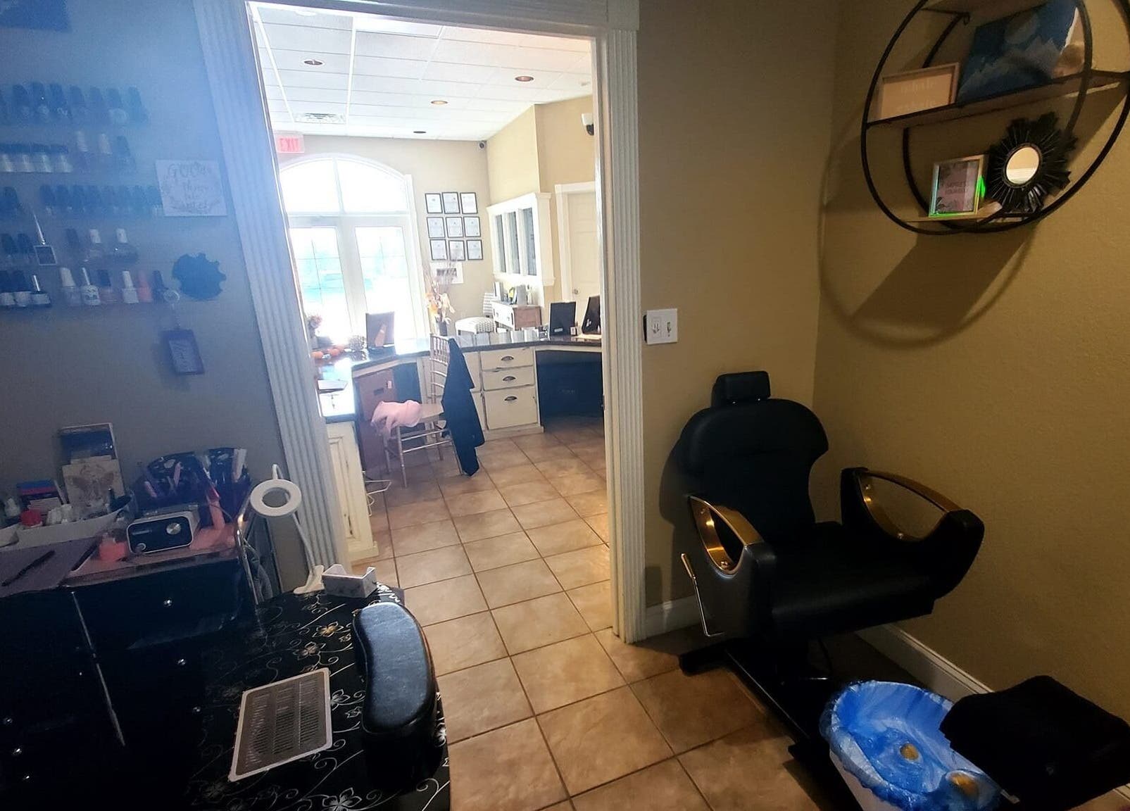 Inviting nail station at Nails by Coco LLC in Van Buren, Arkansas, US, showcasing warm decor and manicure setups.