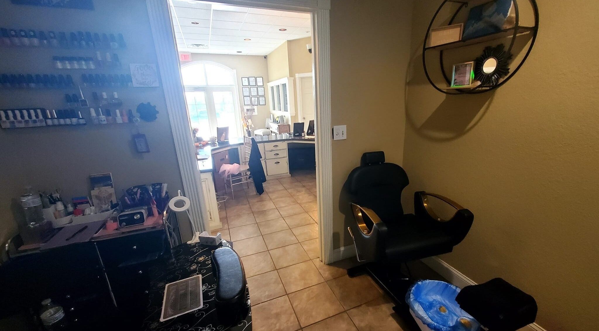 Inviting nail station at Nails by Coco LLC in Van Buren, Arkansas, US, showcasing warm decor and manicure setups.