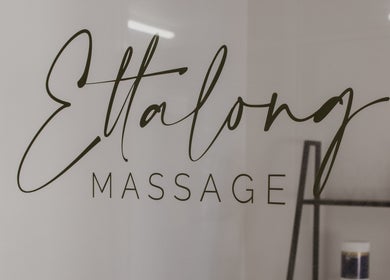 Elegant Ettalong Massage signage at Ettalong Beach, New South Wales, AU on glass door.