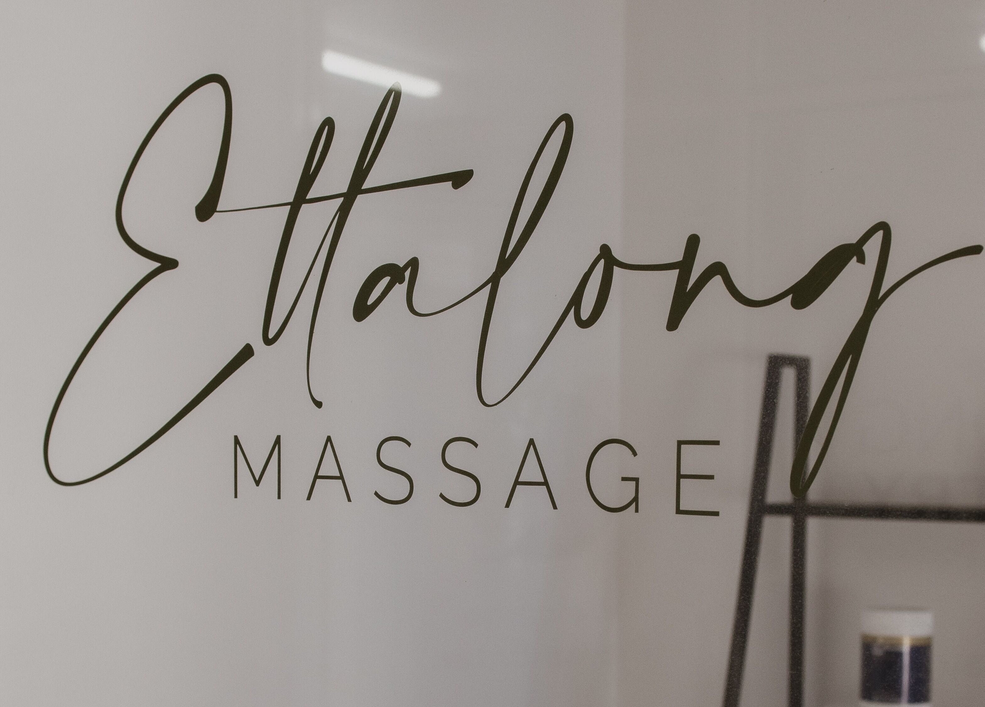 Elegant Ettalong Massage signage at Ettalong Beach, New South Wales, AU on glass door.