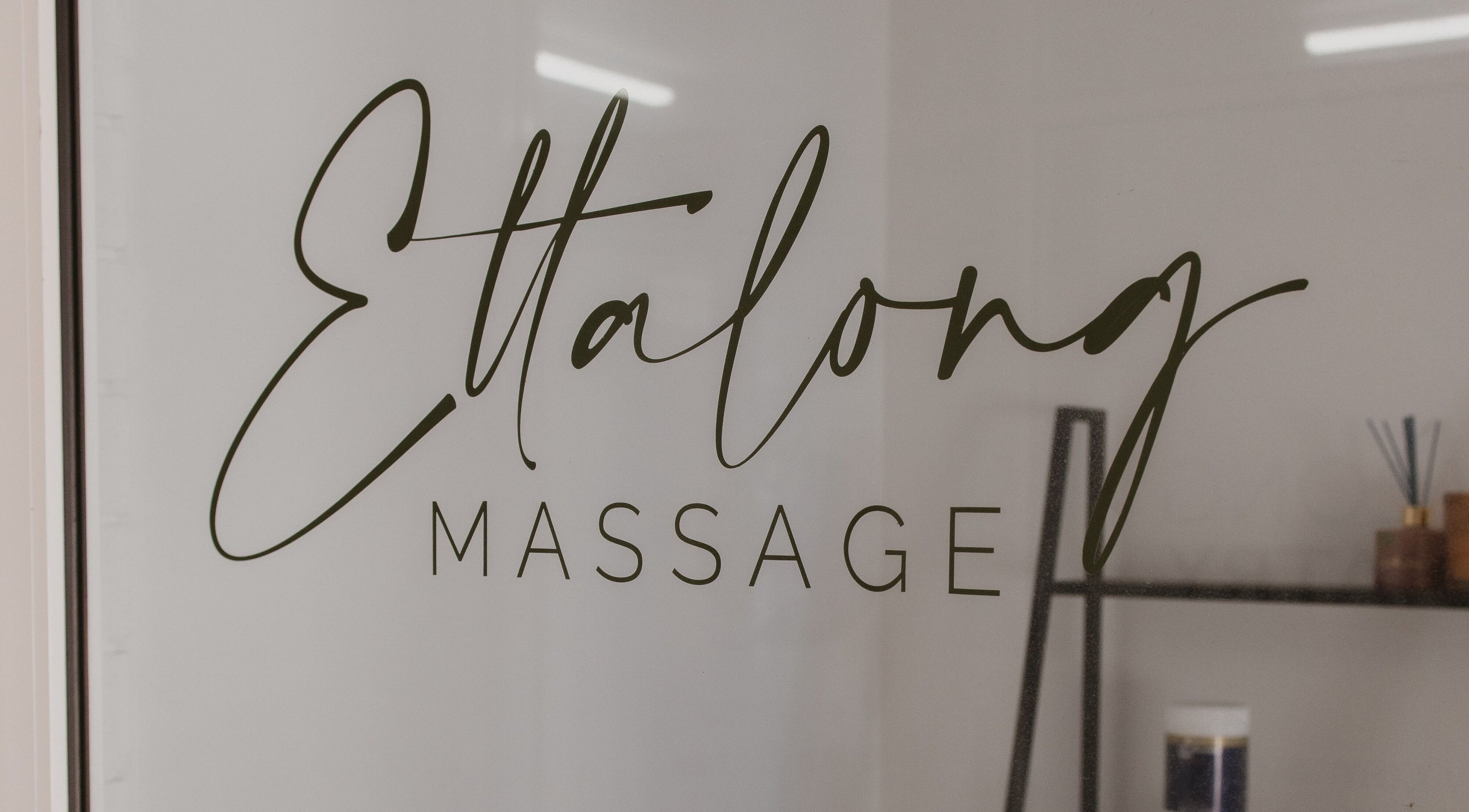 Elegant Ettalong Massage signage at Ettalong Beach, New South Wales, AU on glass door.