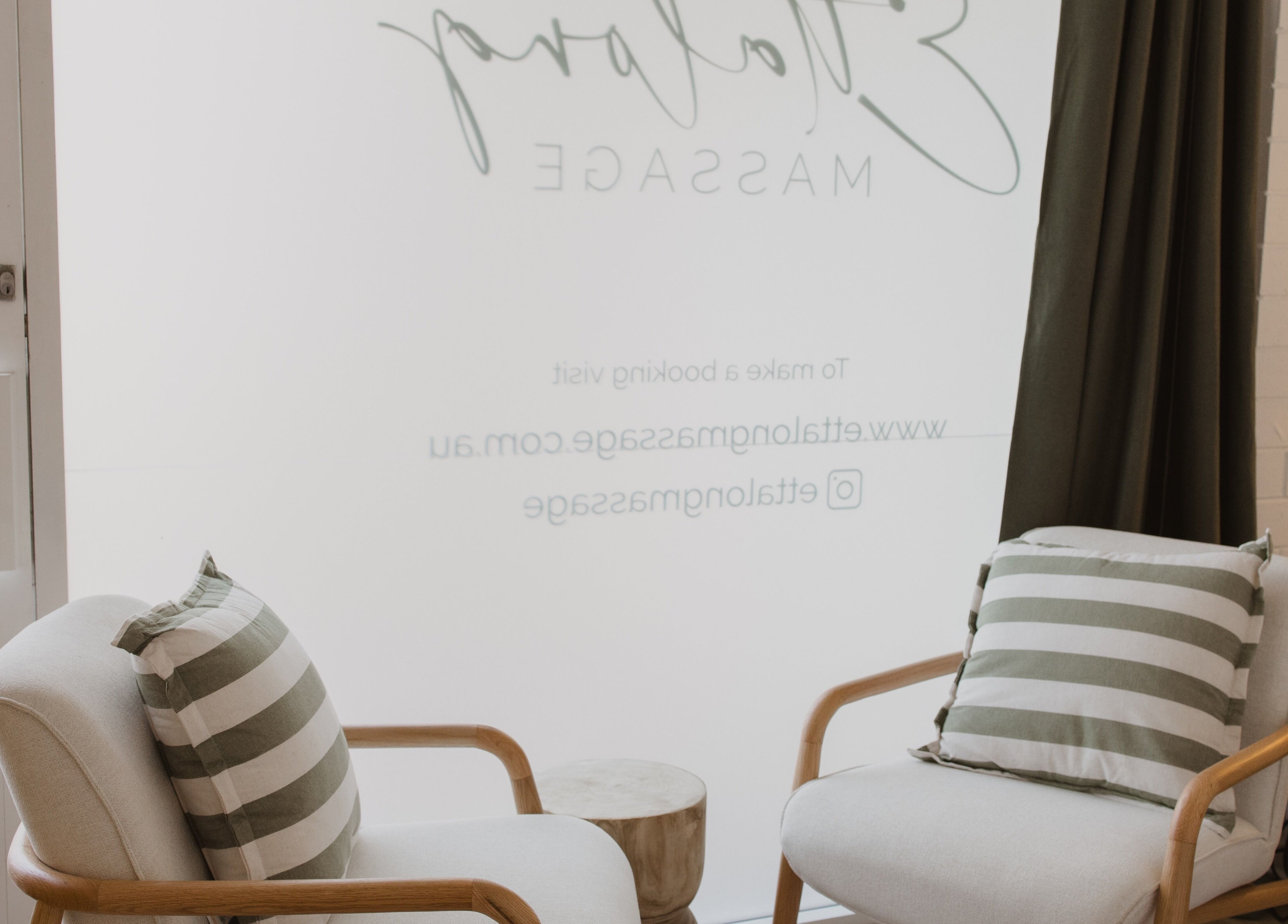Cozy waiting area with striped cushions at Ettalong Massage, Ettalong Beach, New South Wales, AU.