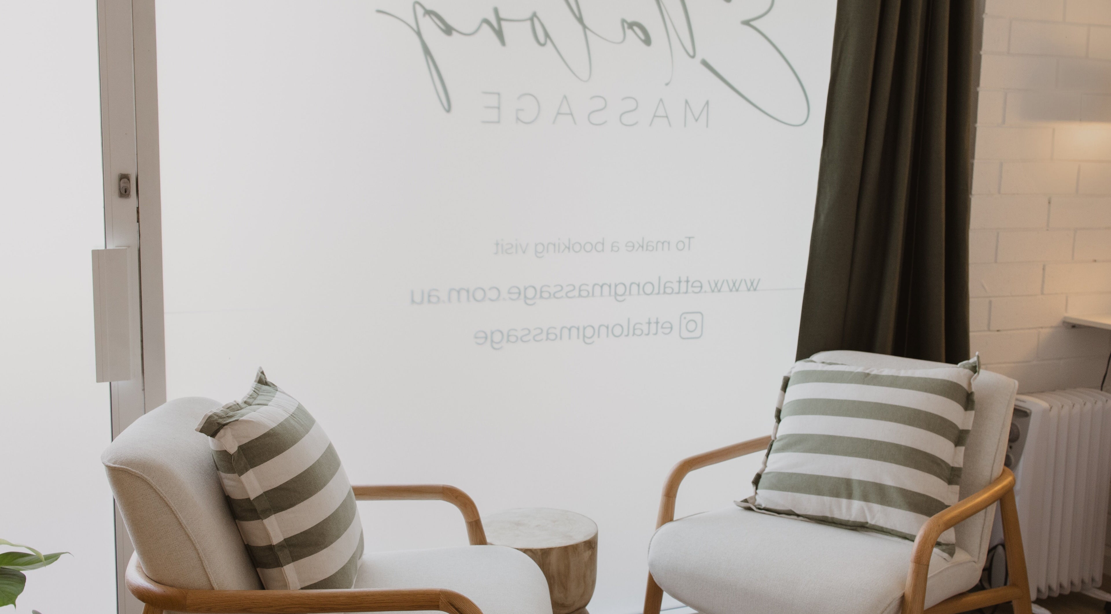 Cozy waiting area with striped cushions at Ettalong Massage, Ettalong Beach, New South Wales, AU.