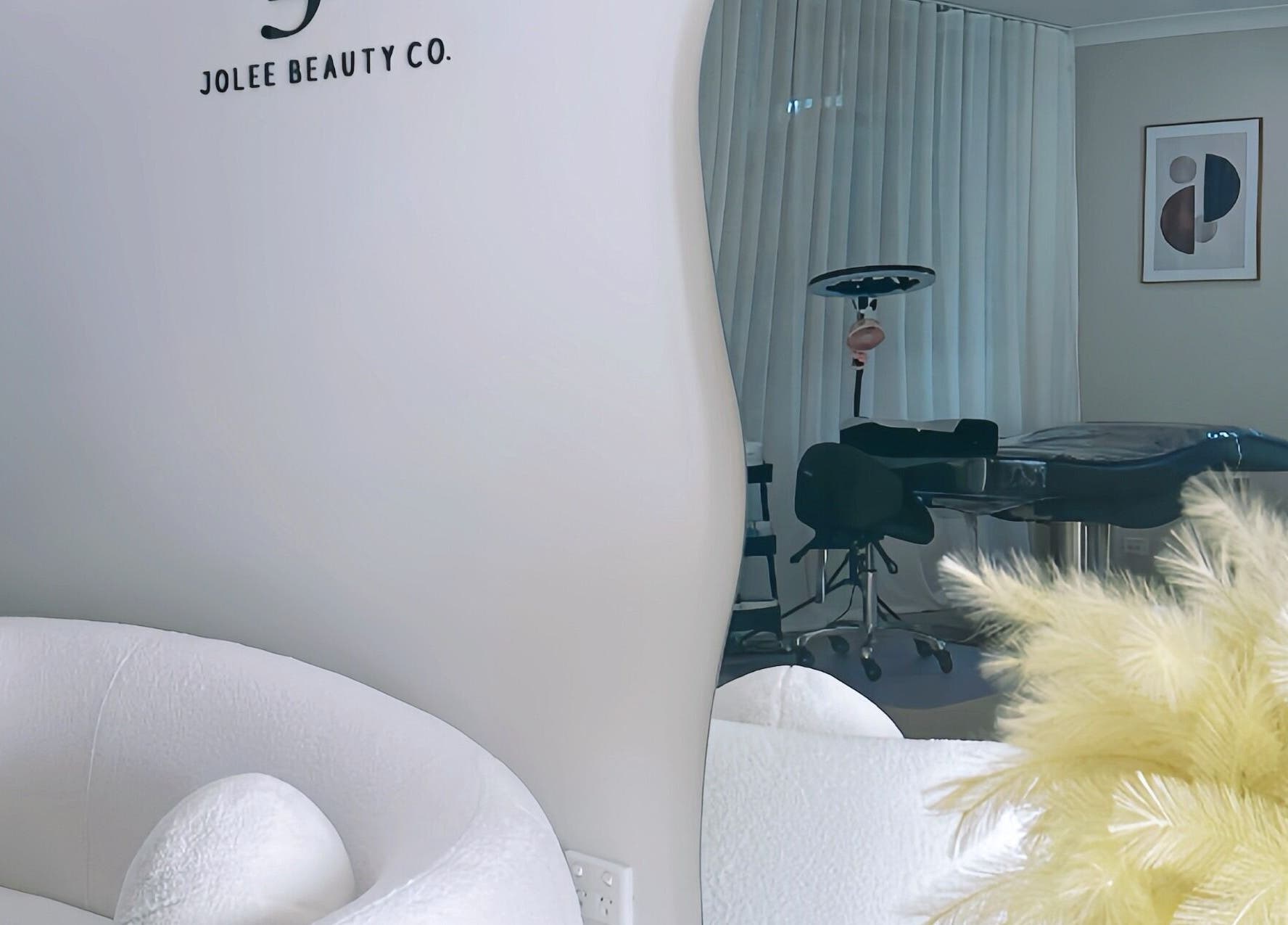 Elegant interior of Jolee Beauty Co - Prestons, featuring plush seating and modern decor in Prestons, New South Wales, AU.