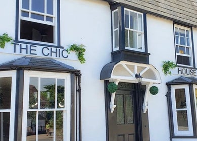 Elegant exterior of Skin by Anna in Biggleswade, England, GB, showcasing classic white facade with large windows.