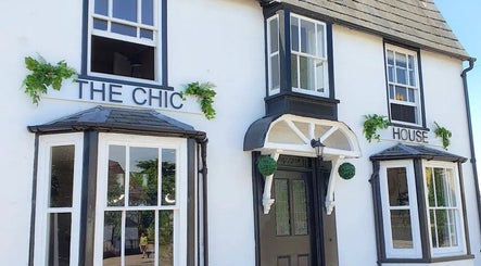 Elegant exterior of Skin by Anna in Biggleswade, England, GB, showcasing classic white facade with large windows.