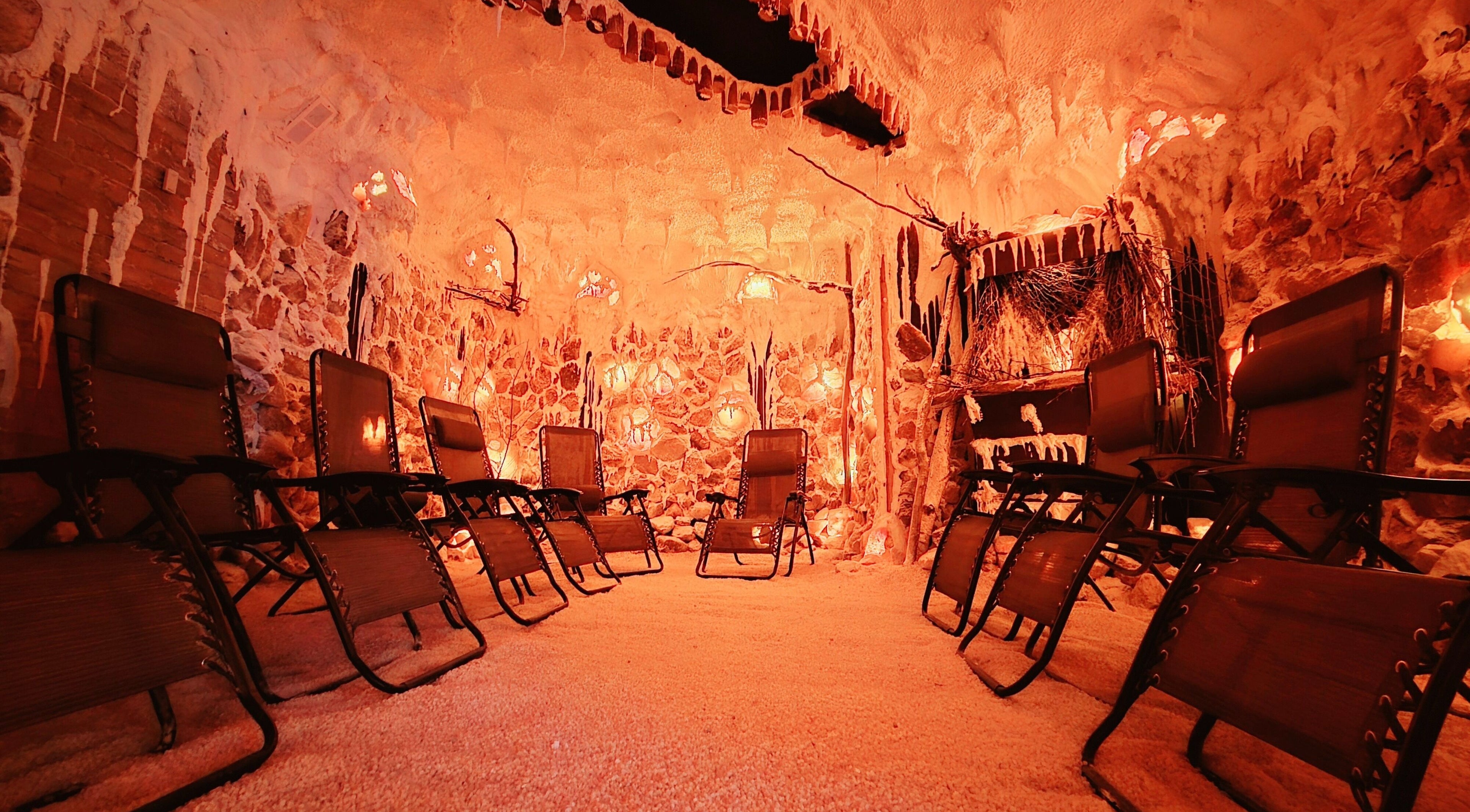 Relaxing salt cave at Simply Salt Wellness & Salt Cave, Welland, Ontario, CA with tranquil seating arrangement.