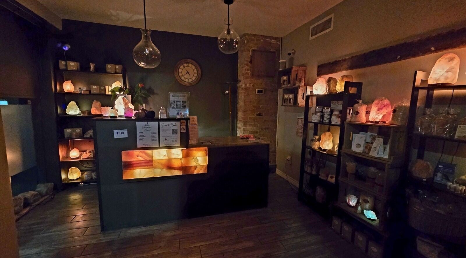 Cozy interior of Simply Salt Wellness & Salt Cave in Welland, Ontario, CA, featuring glowing salt lamps.