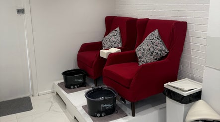 SENNUBIA pedicure chairs with plush cushions in London, England, GB, offering a serene atmosphere for clients.
