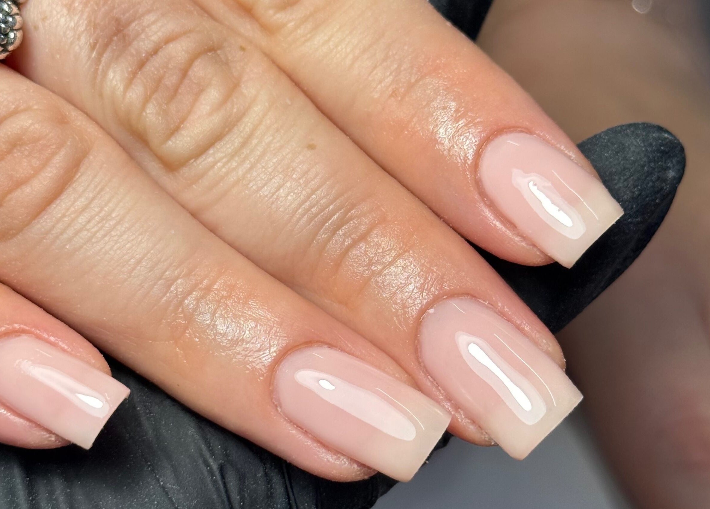 Fresh polished nails at LGD nails, Fareham, England, GB showcasing natural glossy finish.