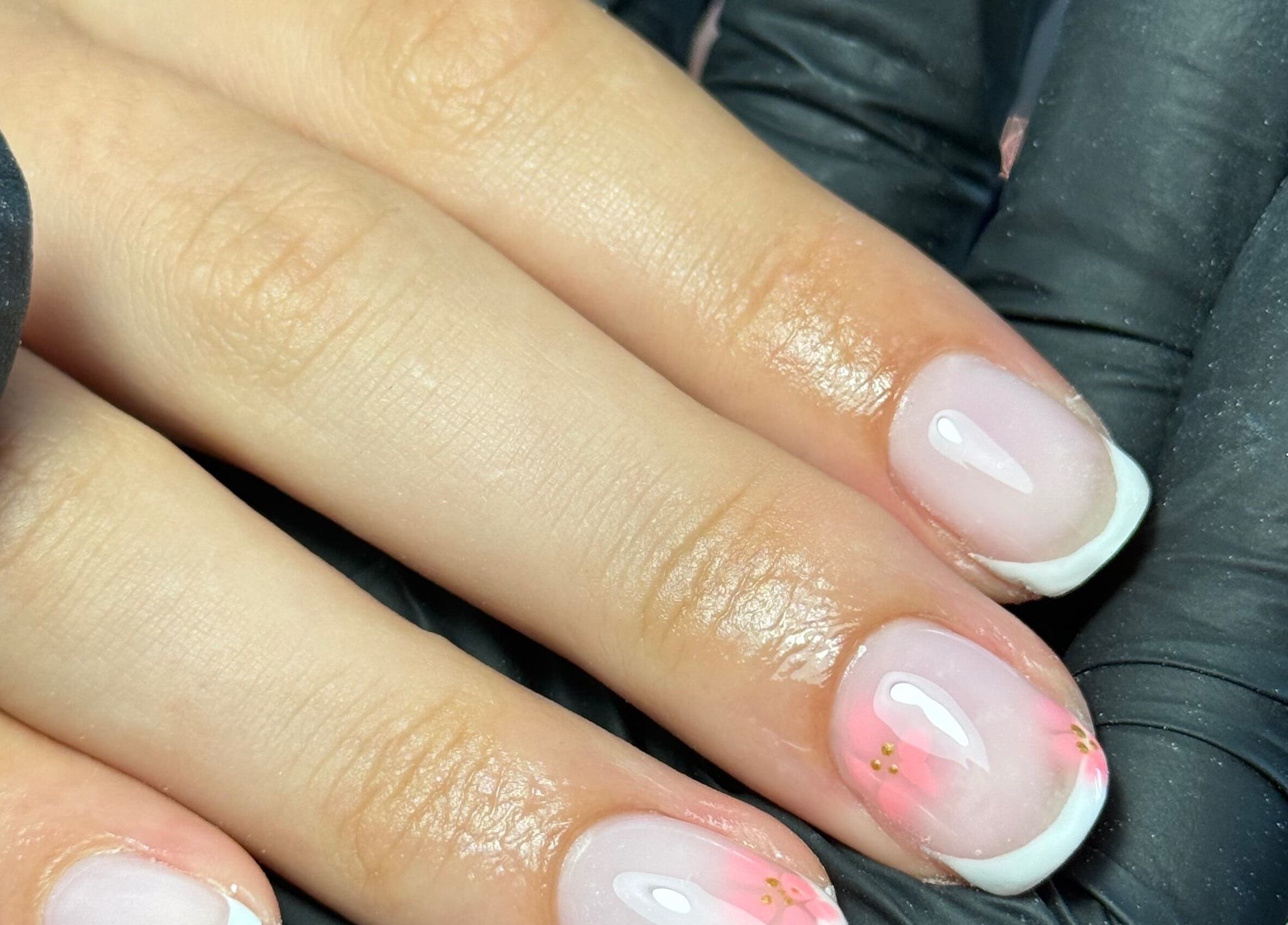 French manicure with floral design at LGD nails in Fareham, England, GB.