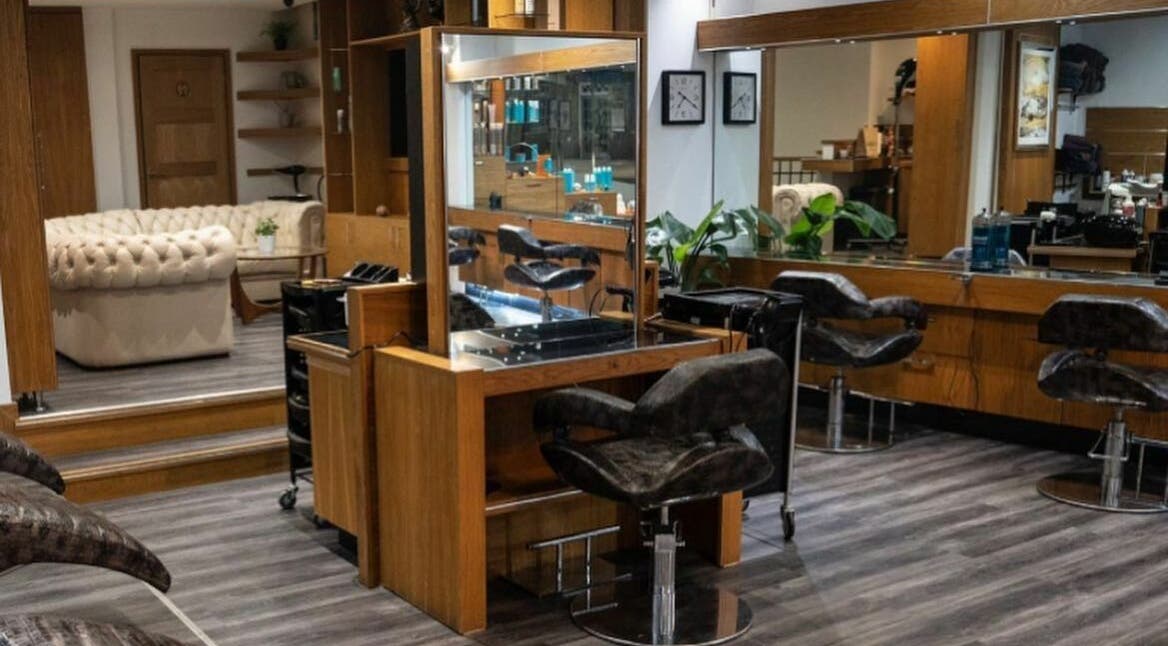 Modern salon chairs and mirrors at Eagles Hair and Beauty in Eastbourne, England, GB, highlighting luxury design.