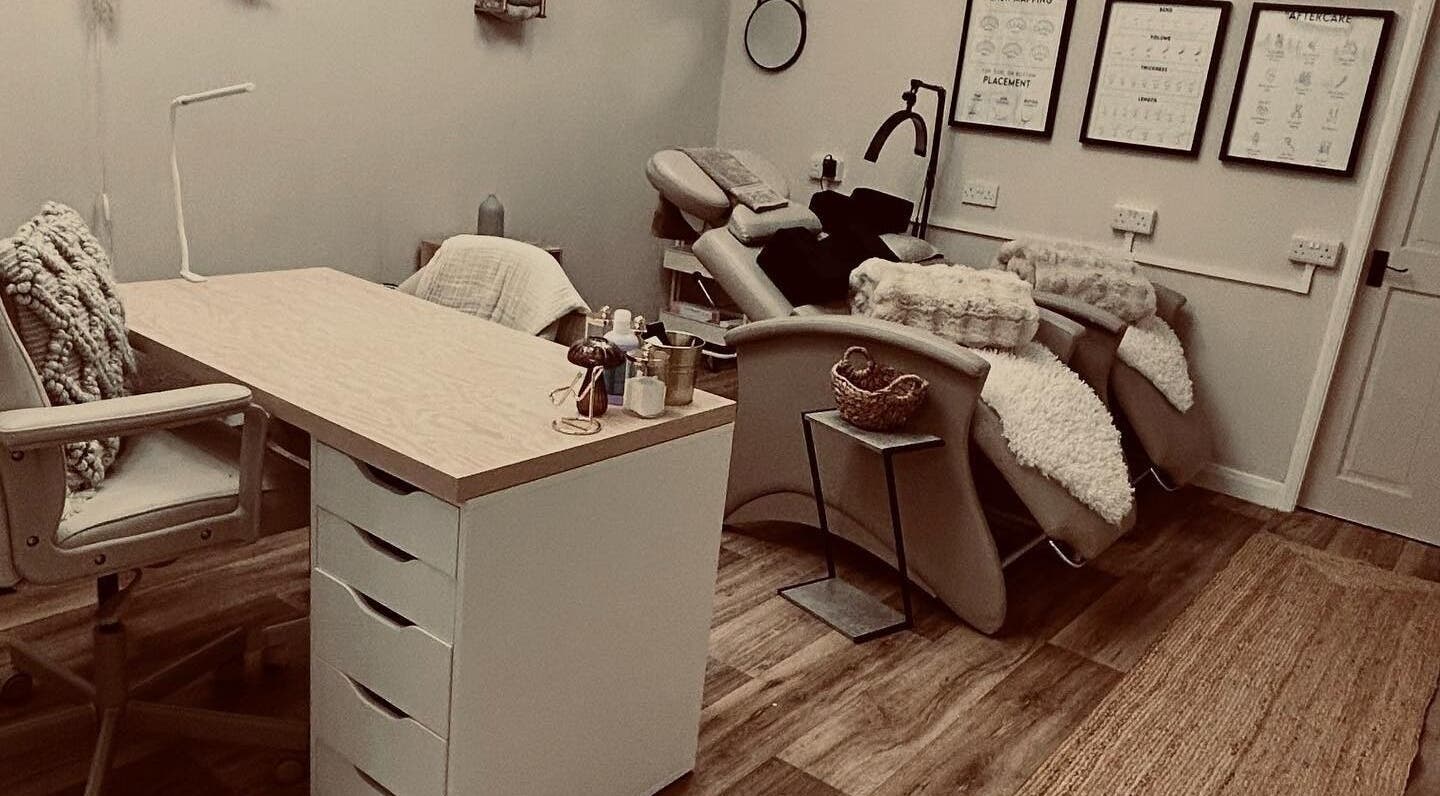 Cozy treatment room at Structure Beauty, Pickering, England, GB, featuring plush chairs and calming decor.