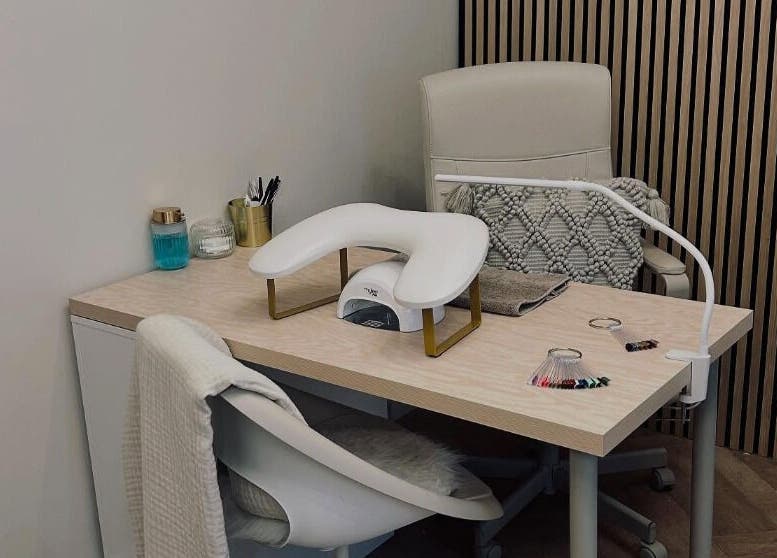 Modern nail station at Structure Beauty, Pickering, England, GB, featuring elegant decor and professional tools.