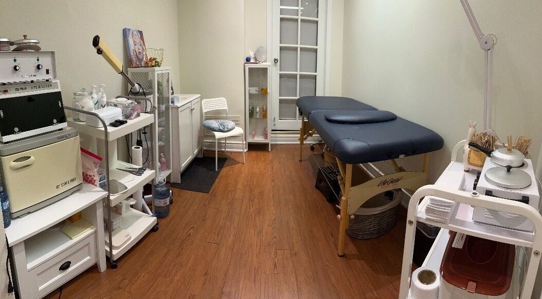 Tranquil treatment room at Lisbeth Beauty Studio, Toronto, Ontario, CA, with massage table and calming decor.