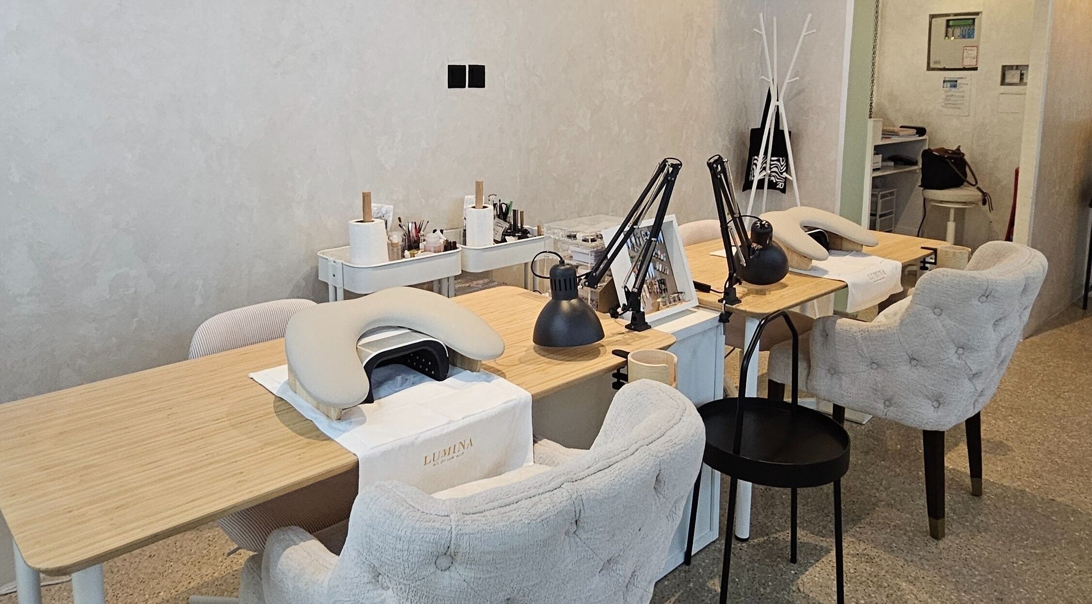 Chic manicure station at Lumina Nail & Lash Salon, الدوحة, بلدية الدوحه, QA with plush chairs and tools.