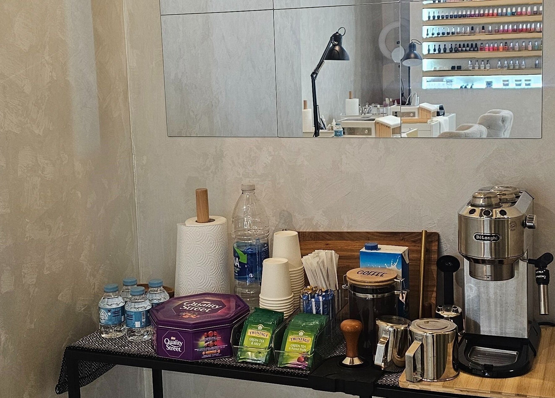 Refreshment area at Lumina Nail & Lash Salon, الدوحة, بلدية الدوحه, QA with coffee maker and treats.