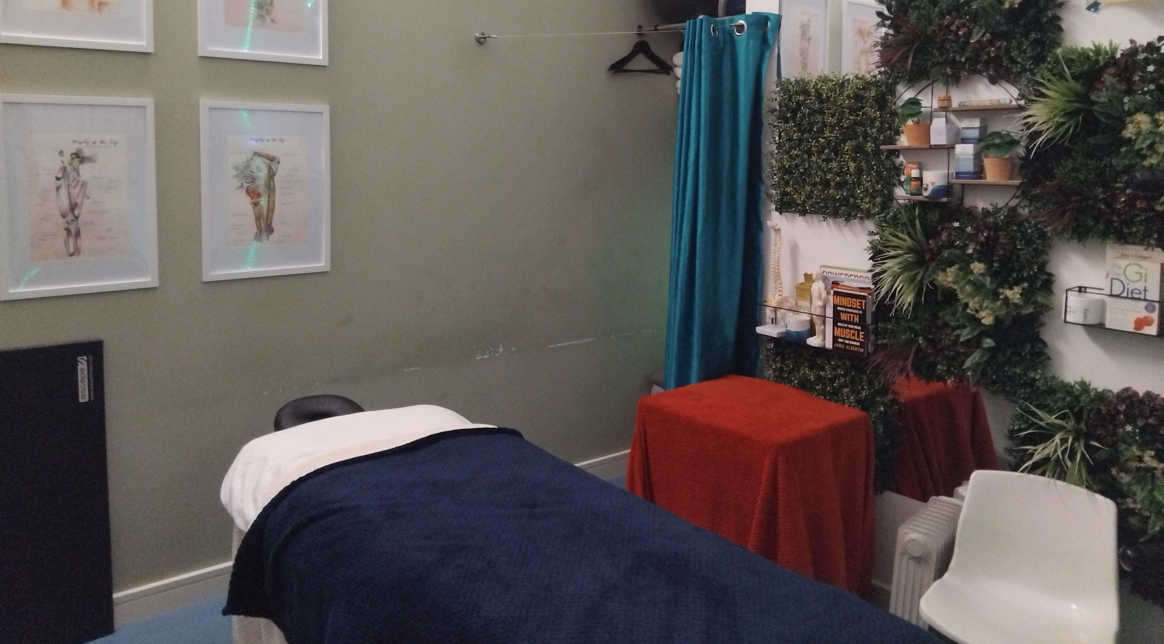 Relaxing massage room at Mode1 Fitness, Everlast Gyms Bangor, Northern Ireland. Cozy and inviting atmosphere.