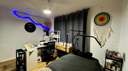See More Beauty spa room with cozy decor in Marcoola, Queensland, AU, featuring colorful macrame and workspace.