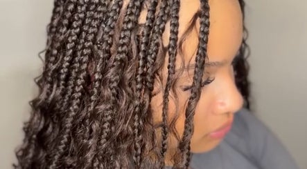 Intricate braids hairstyle at TC Styledit, Nottingham, England, GB, showcasing expert styling and attention to detail.