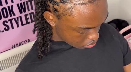 Intricate braided hairstyle at TC Styledit, Nottingham, England, GB showcases precise styling techniques.