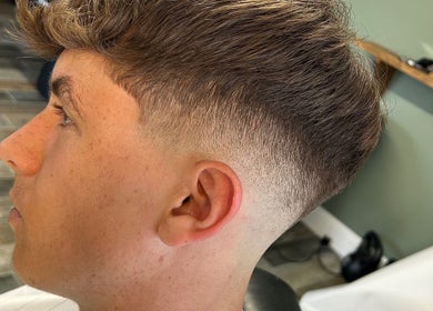 Sharp fade haircut at LS Cuts, Scunthorpe, England, GB showcasing expert styling.