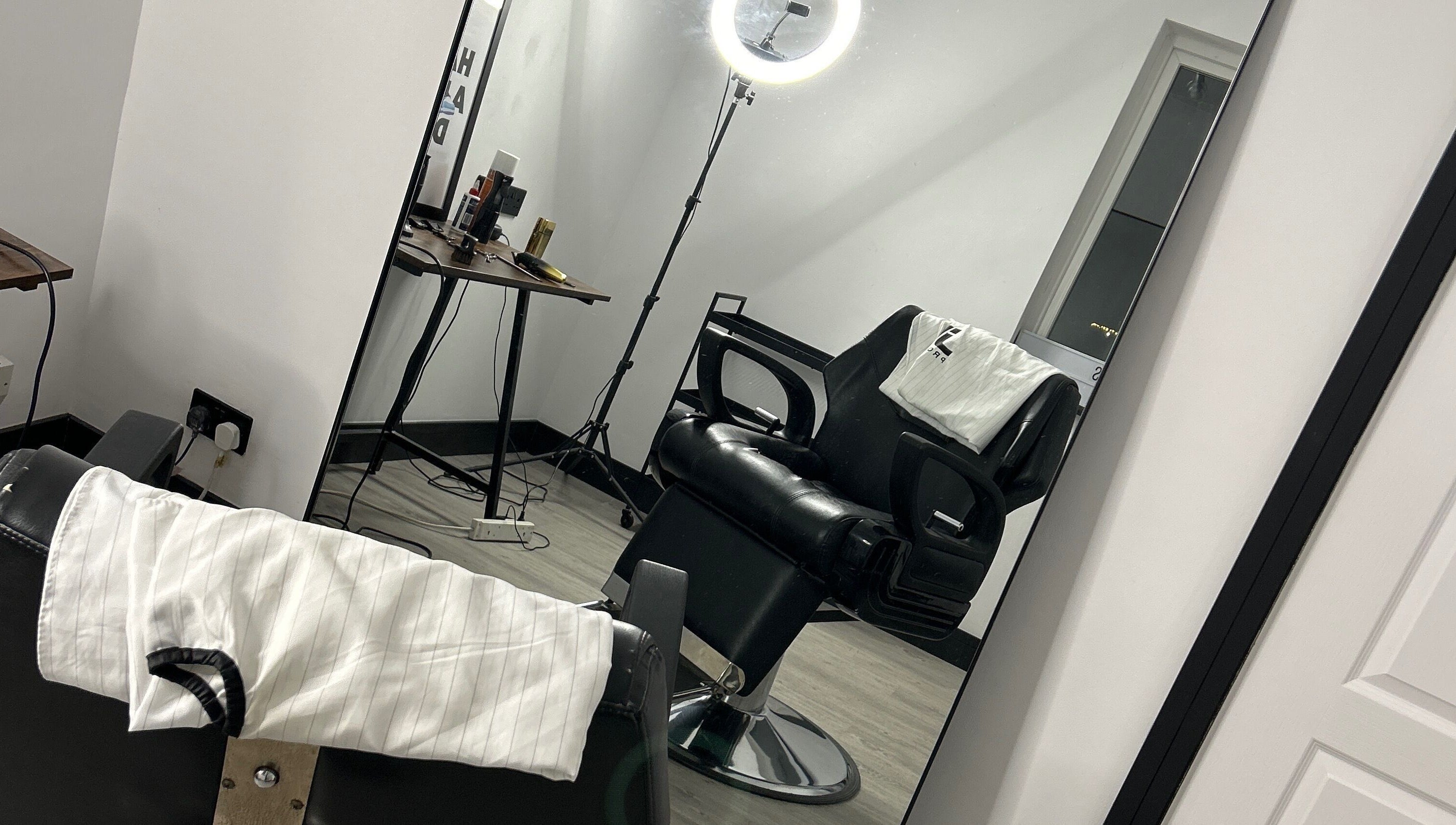 Modern barber chair at LS Cuts in Scunthorpe, England, GB with sleek styling tools.