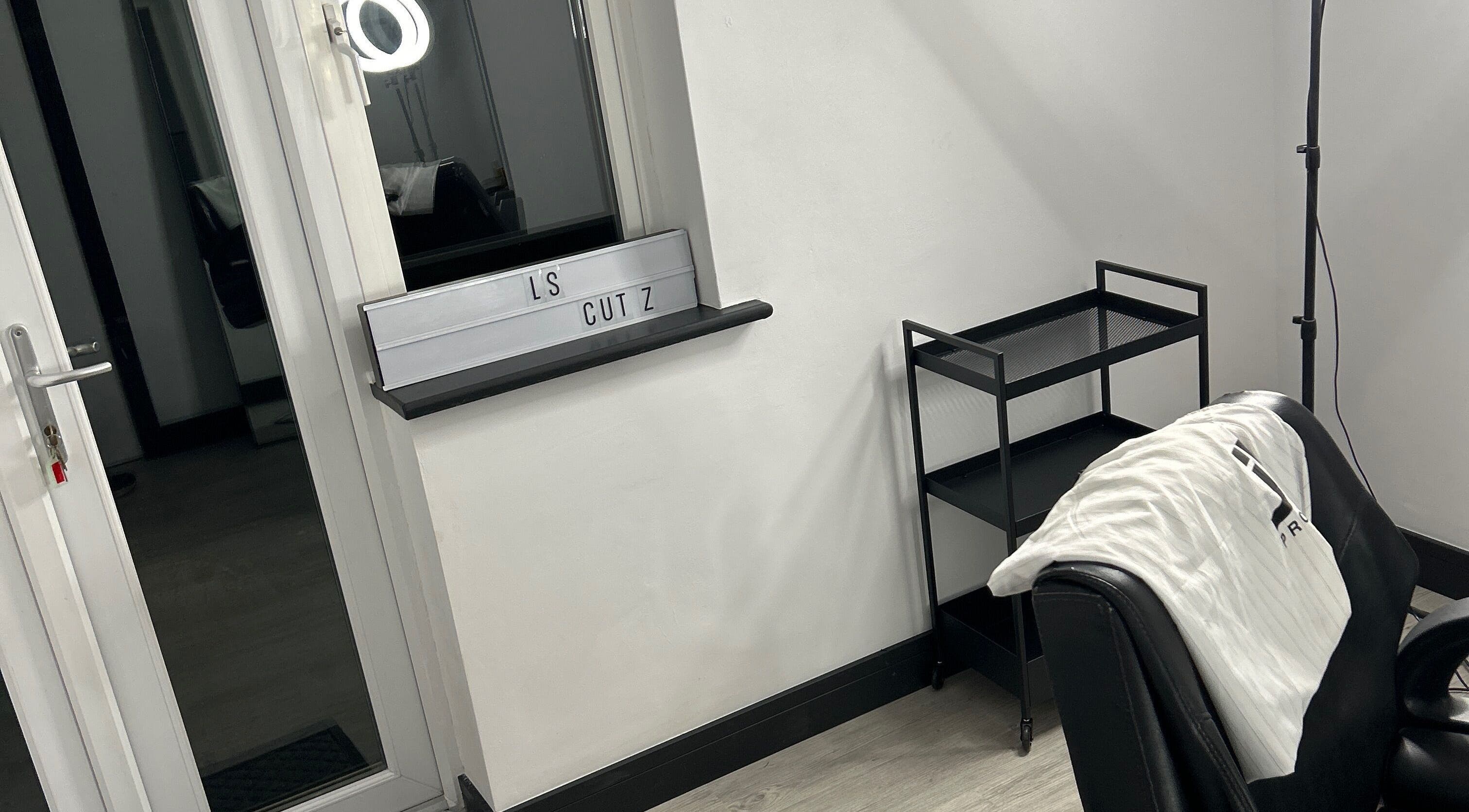 Modern styling chair and station at LS Cuts in Scunthorpe, England, GB, showcasing sleek salon interior.