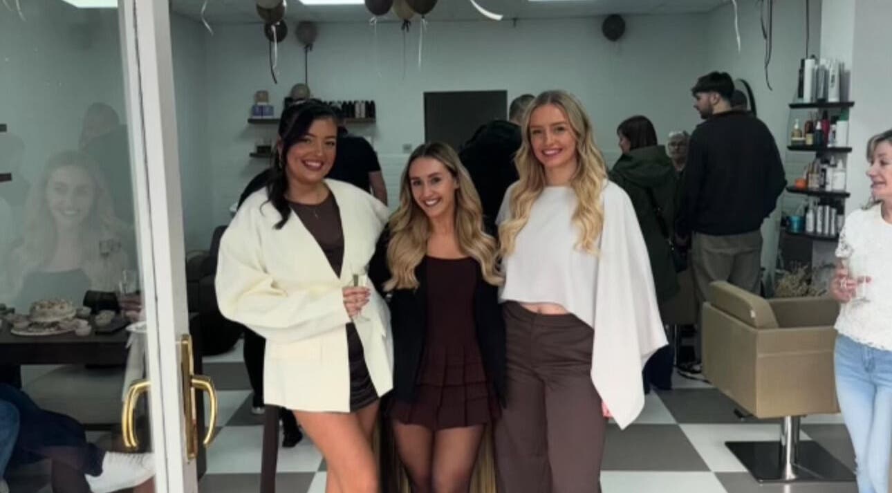 People celebrating inside Fawn Studios, Hyde, England, GB. Elegant space with attendees smiling together.