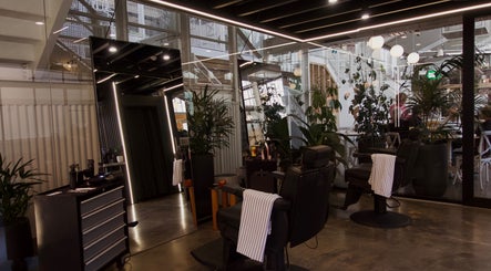 Modern salon at Frank - Lately with sleek design and greenery in Bowden, South Australia, AU.